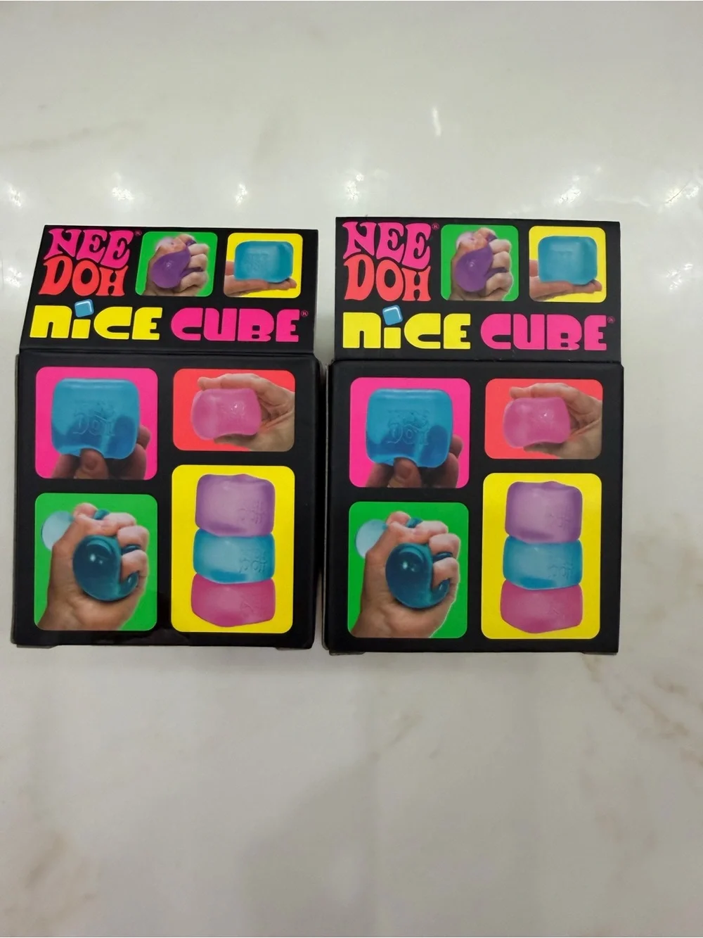 NeeDoh Nice Cube Super Solid Squish Toy - 2 Pack Bundle. Blue, Pink